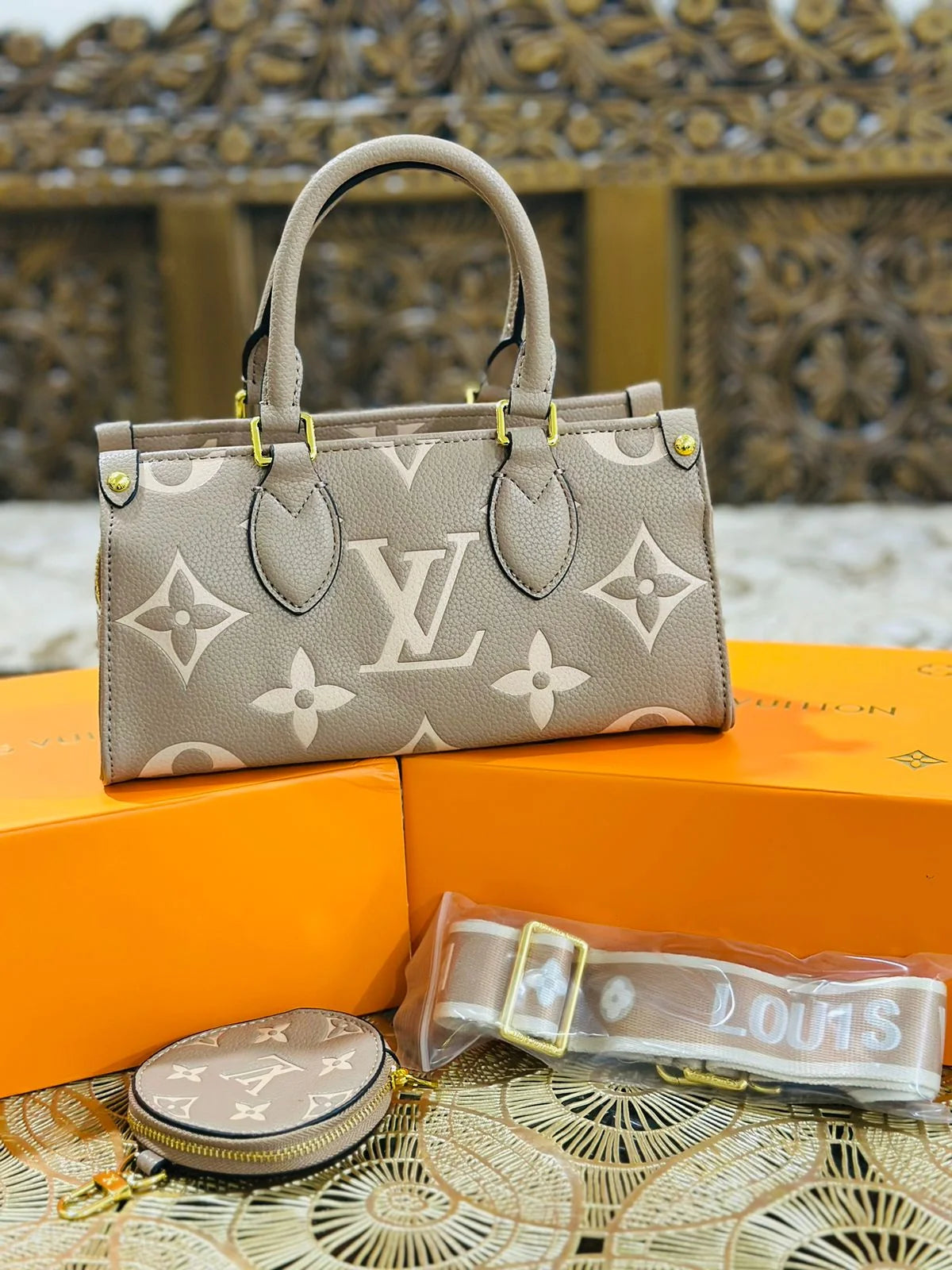 LV OnTheGo East West Monogram Reverse Canvas - Beige