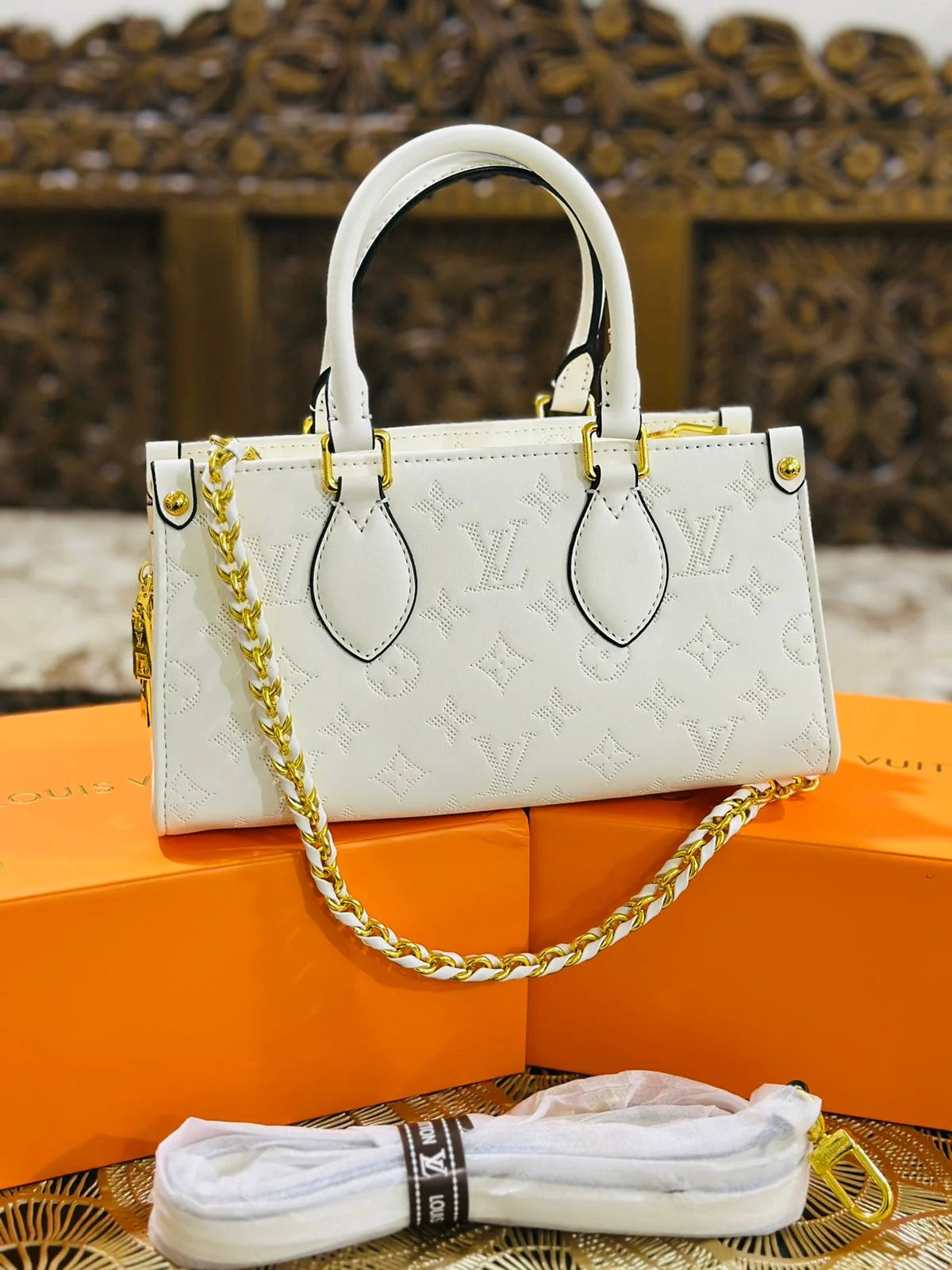 LV OnTheGo East West Monogram Empreinte Leather Bag - White