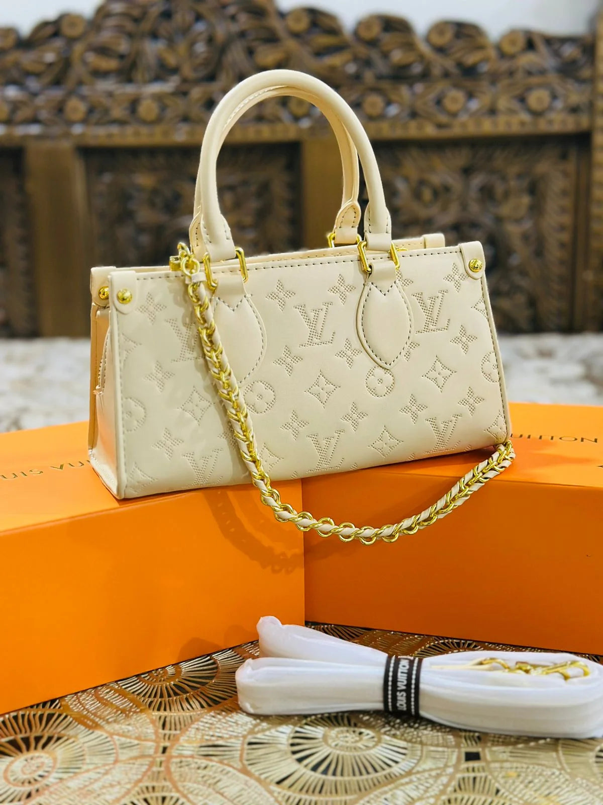 LV OnTheGo East West Monogram Empreinte Leather Bag - Cream